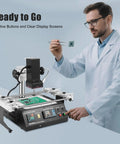 Man operating Infrared Rework Station With 1250W Hot Air Soldering Reflow System Temperature Sensor on PC board