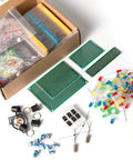 All In One Mega Electronic Component Kit With 1900 Pieces Including Capacitors Resistors LEDs Transistors Diodes 1N270 Germanium DC Jacks Op Amps PCBs And A Speaker For DIY Prototyping Projects For Nerds, showing assorted components and PCBs on display