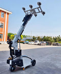 Pro Level Hydraulic Glass Lifter Packing Killer Suction Grip To Effortlessly Tote Heavy Marble Granite And Quartz Slabs Around Busy Work Sites Without Raising A Sweat, machine in outdoor setting, visible suction cups.
