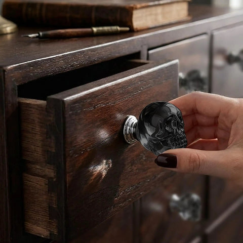 Sick Badass Crystal Skull Drawer Knobs Four Pack Heavy Duty Glass Cabinet Pulls Handle Gray Gothic Statement Piece For Dresser And Halloween Decor close-up, mounted on a wooden dresser.