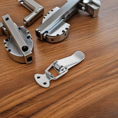 Stainless Steel Spring Loaded Toggle Latches 10 Pack Heavy Duty Quick Release Pull Handles For RV Cabinets, Travel Bags, And Outdoor Gear Case Closure Clasp Super Sturdy Design on wooden surface.