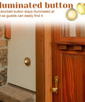2 Pack Lighted Doorbell Button Replacement Kit with round gold rim and bright center LED installed on wall next to wooden door.