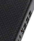 Close-up of Compact Mini Ups Backup Battery featuring USB and power ports on a textured black surface.