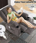Woman relaxing on oversized recliner chair for adults with vibration massage and lumbar heating, showing USB charge port and cup holder.