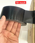 Hand holding Five Pack Black Heavy Duty Duct Tape 2 Inches By 30 Yards Waterproof Tear By Hand All Weather Residue Free Strong And Flexible