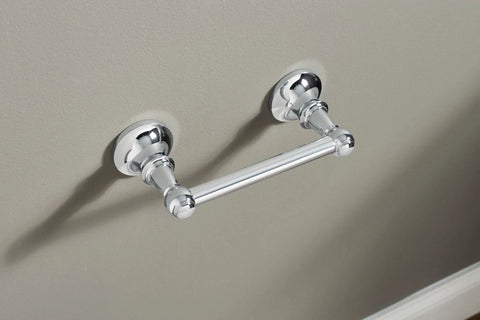 Vale Chrome Double Post Pivoting Toilet Paper Holder Wall Mounted Tissue Dispenser With Easy Roll Change, shown on wall