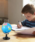 Large Desktop World Globe With Stand For Adults High Definition Geographic Tabletop Globe in home setting with boy studying