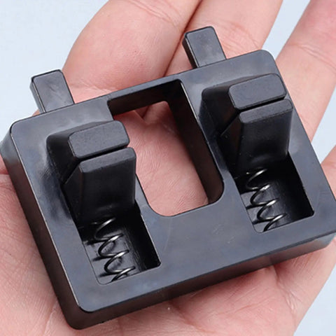Heavy Duty Wire Welding Holder Clamp With High Temp Resistant ABS Base to grip loose cables, shown in hand, compact design.