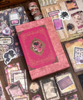 All In One Vintage Junk Journal Kit With 185 Pieces Scrapbook Paper Pack A6 Aesthetic Notebook Scrapbook Kit Art Craft Diy Gift For Adults Women Starter Friendly displayed with pink box and decorative papers.