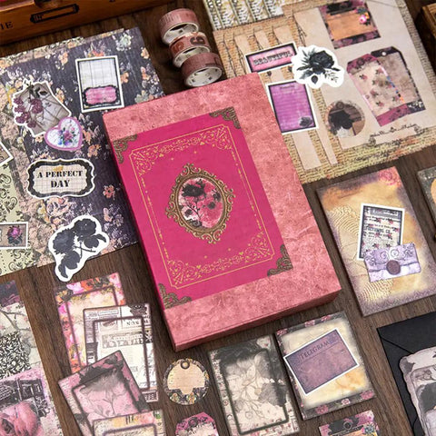 All In One Vintage Junk Journal Kit With 185 Pieces Scrapbook Paper Pack A6 Aesthetic Notebook Scrapbook Kit Art Craft Diy Gift For Adults Women Starter Friendly displayed with pink box and decorative papers.