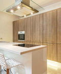 Modern kitchen with 10 Pack Square Cabinet Pulls 10 Inch Brushed Brass Gold on wooden cabinets and sleek white counter.