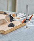 Heavy Duty Table Saw Presser With Adjustable Cast Iron Clamp For Woodworking Projects showing black and silver adjustable clamp on wood.