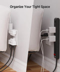 ETL Listed 2-Pack 3-Outlet Grounded Wall Tap With 180 Degree Swivel, behind couch, organizing cables, white color.