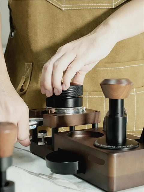 User preparing coffee tools on Smooth Operator Wood Espresso Tamper Station Fits 51 And 58 Mm Baskets Non Slip Base.