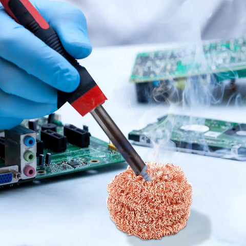Top Grade Solder Tip Cleaning Brush Made With Heavy Duty Wire Sponge For High Temp Irons cleaning soldering iron on a circuit board.