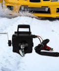 Rock Solid 12V Boat Winch With 300W Copper Motor Brings Heavy Loads Easy Peasy Featuring 6000 lbs with steel cable and manual crank.