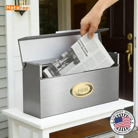 Person placing newspaper into a weatherproof wall mount mailbox outdoor heavy duty stainless steel drop box keeps mail dry in rain with drip edge design 3.75 by 14.5 by 7.1 inches silver