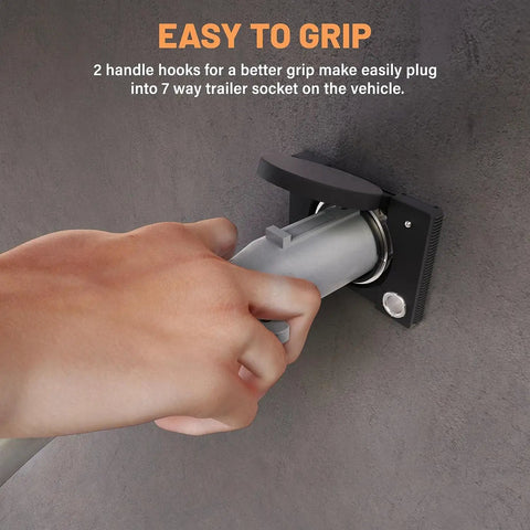 Hand gripping Detachable 7 Way RV Style Trailer Plug with IP68 Waterproof Seal, showcasing easy grip and connection to socket.