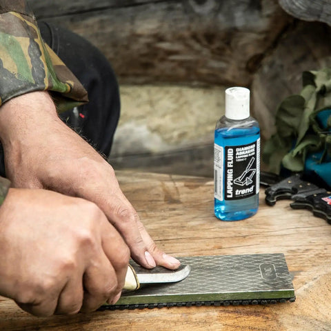 Sharpening a knife on Pro Grade Diamond Sharpening Stone Kit for Knife and Chisel Honing, double sided bench stone visible