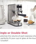Straight Up Solid Steam Espresso Maker And Coffee Brewer With Handy Milk Frother and Cup Warmer, stainless steel brewer making espresso shots.