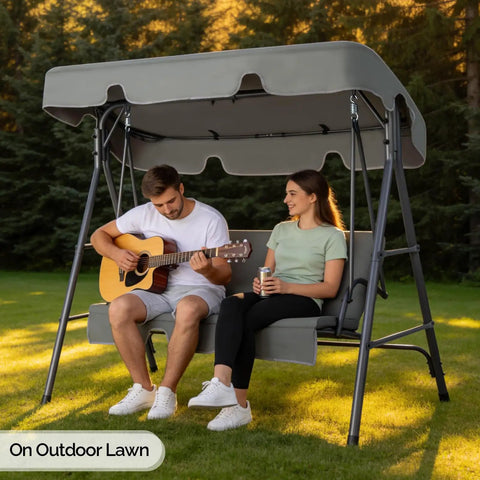 Outdoor Porch Swing With Adjustable Canopy And Durable Steel Frame On Heavy Duty Stand For Patio Backyard Or Garden in use
