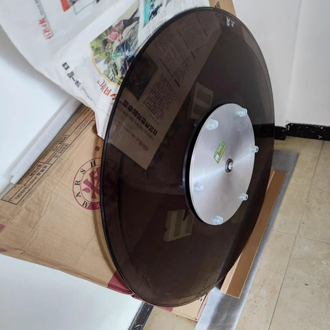 Premium Tempered Glass Lazy Susan Turntable And Slick Swivel Serving Tray with aluminum base on cardboard surface.