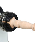 4-jaw self-centering wood lathe chuck in black metal gripping a turned wooden spindle