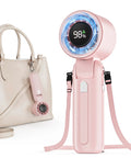 Pink Turbo Handheld Fan 12800 RPM Ultra Portable 4 In 1 Mini Fan with USB-C and bag attachment shown next to beige handbag.