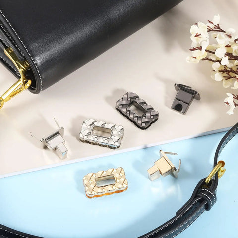 Hella Solid Gold Twist Turn Lock Clasps For Handbags And Purses Heavy Duty Aluminum Alloy rectangle bag closures on a table.