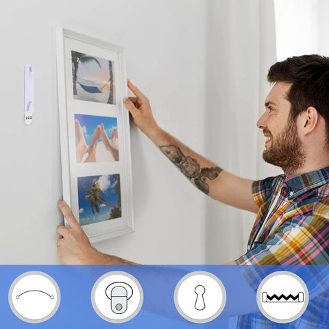 Man using Damage Free Adhesive Picture Hangers 20 Pack No Nails Mounts That Hold Up To 4 Lbs Each in white on wall