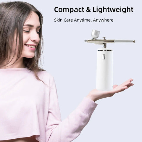 Woman holding Nano Facial Steamer Rechargeable Portable High Pressure Oxygen Sprayer For Ultra Fine Cool Mist Hydration