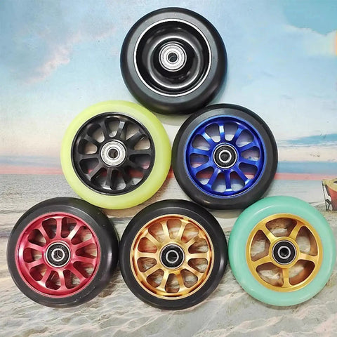 Assorted colored inline skate wheels with bearings, showcasing Beast Mode Speed Inline Skate Wheels 100mm and 110mm set of 2