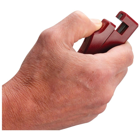 Hand holding a red Self Powered Timing Light With Daylight Readable Xenon Bulb, Self Contained Automotive Ignition Timing Tool.