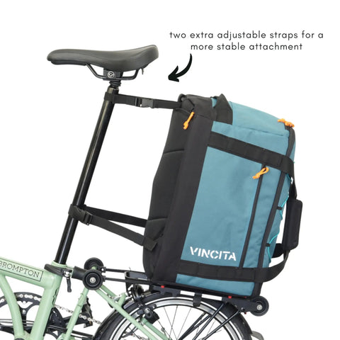 Road Ready Three In One Rear Rack Bag That Transforms From Backpack To Duffle To Pannier 37L mounted on a folding bike
