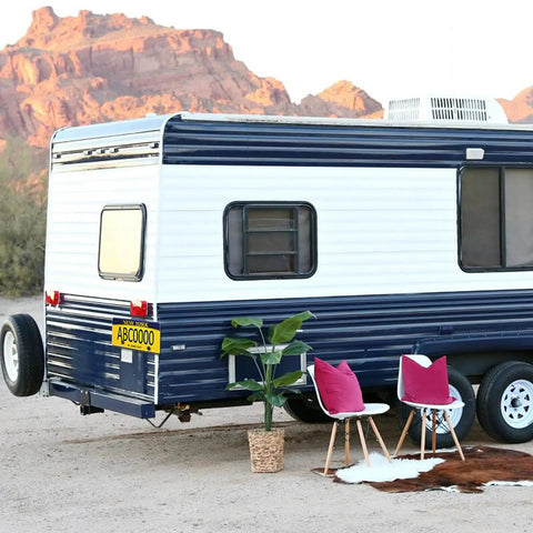 Beefed Up Heavy Duty Black Stainless Steel Trailer License Plate Bracket Holder on RV in desert setting