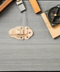 Six Pack Golden Metal Toggle Latches For Craft Chests And Suitcase Closures on wooden surface with measuring tools