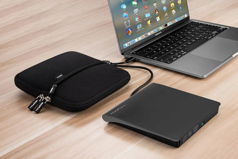 External CD DVD Drive For Laptop And Mac With Case USB 3 Type-C Plug And Play For Reading Burning And Watching CDs And DVDs On The Go Wide Compatibility Compact Portable Design, black drive with carrying case beside MacBook