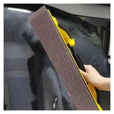 Hot 70X420mm Rectangular Dry Sanding Mesh Paper With Back Flocking For Car Putty Board Smoothing orange mesh with yellow handle on car surface.