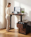 Woman using Smooth Electric Sit Stand Desk with motorized height adjustment, spacious 46-inch brown surface for monitors and laptops.