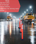 Real McCoy Heavy Duty Traffic Delineator Posts With Weighted Rubber Bases And Bright Reflective Strips For Parking Lot Safety Markers Road Construction Warning Stakes 42 Inch Tall Six Pack in a rainy road setting.