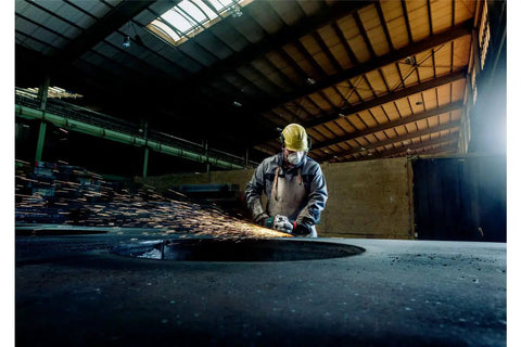 Worker using 9-Inch Angle Grinder With Lock-On Trigger, 6600 RPM, 15 Amp, W24-230 MVT in industrial workshop environment