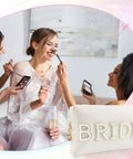 Bride Patch Makeup Bag With White Pearl Rhinestones For Women shown with bride applying makeup, white PU leather with BRIDE patch