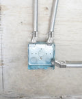 Installed Four Pack Half Inch EMT To Box Offset Connectors With Set Screw And Lock Nut Conduit Fittings on galvanized steel electrical box