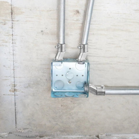 Installed Four Pack Half Inch EMT To Box Offset Connectors With Set Screw And Lock Nut Conduit Fittings on galvanized steel electrical box