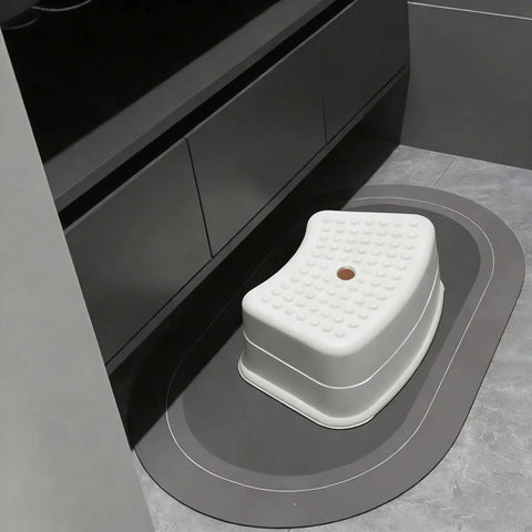 Heck Of A Sturdy Kids Step Stool With Super Grippy Non Slip Feet For Little Ones Reaching The Bathroom Sink Or Finishing Potty Training Without Any Wobbles on gray mat.