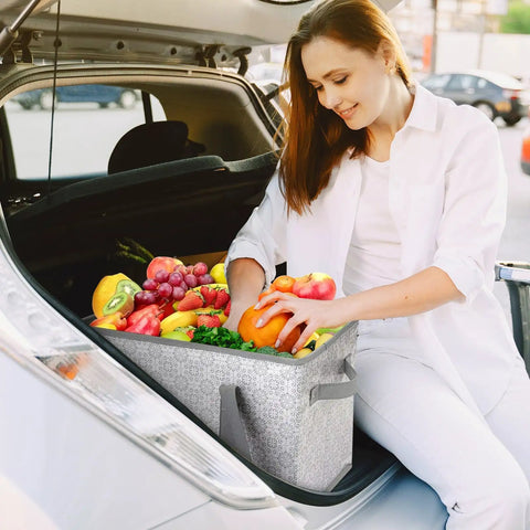 Woman using Three Pack Large Reusable Grocery Bags Water Resistant Tote That Folds Flat For Easy Storage in car trunk with produce.