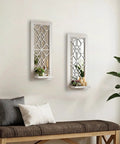 Solid Wood Farmhouse Candle Sconces Set Of Two Wall Mount Holders With Mirrored Backdrop on beige wall with decorative plants and candles.