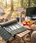 Pro Grade Heavy Duty Waxed Canvas Knife Roll Case For Chefs on wooden table with cutting board at campsite