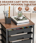 Five Tier Rolling Storage Cart With Wood Top On Wheels For Home Office Classroom Craft Room And Kid Room Mobile Drawer Trolley With Two Big Drawers And Three Small Drawers Black with items on top