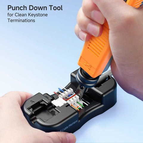 Using punch down tool from 7-In-1 Pro Grade Network Tool Kit for Fast DIYer Ethernet Builds to connect Ethernet cables.